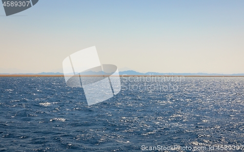 Image of Land over the horizon with mountains