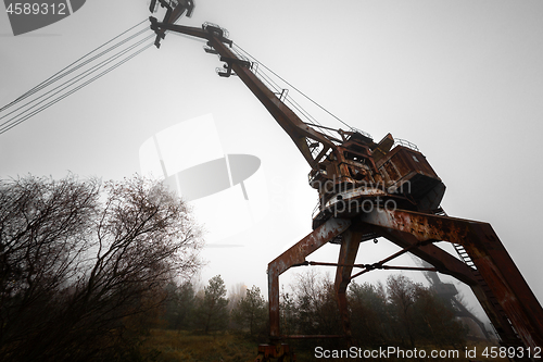 Image of Rusty old industrial dock cranes at the Dock