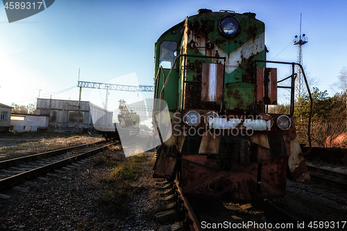 Image of Abandoned train left outside at train station