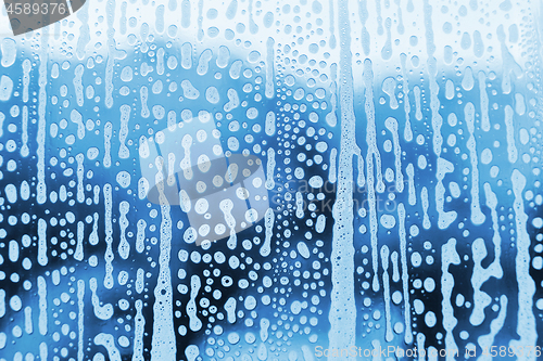 Image of Abstract texture with soap foam pattern on glass