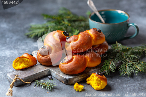 Image of Homemade Swedish buns with saffron and raisins.