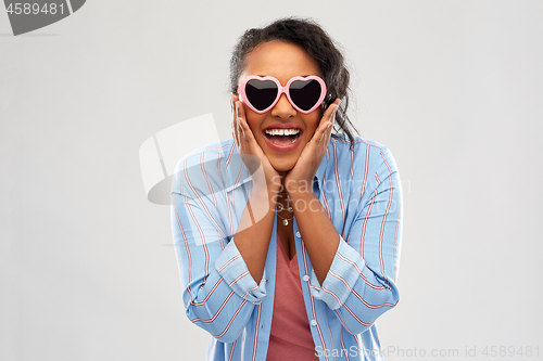 Image of african american woman in heart-shaped sunglasses