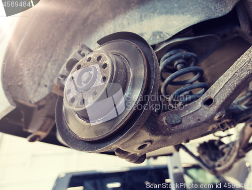 Image of car brake disc at repair station