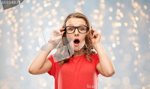 Image of surprised or shocked teenage girl in glasses