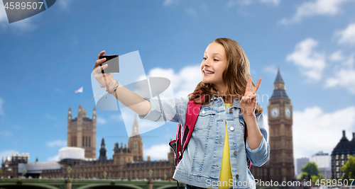 Image of teenage student girl taking selfie by smartphone