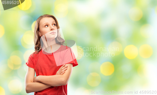 Image of teenage girl in red t-shirt with crossed arms