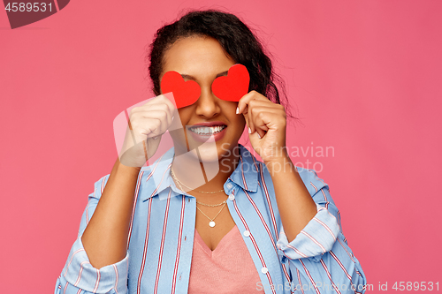 Image of happy african american woman with eyes of hearts