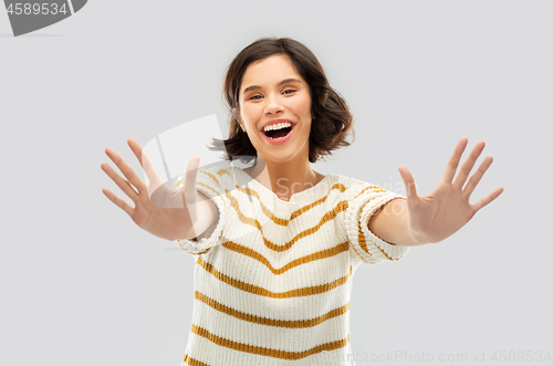 Image of happy woman showing ten fingers of two hands