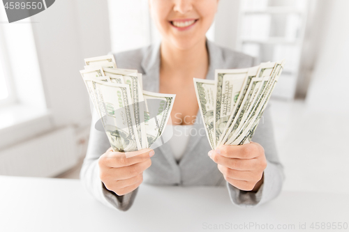 Image of close up of woman hands holding us dollar money