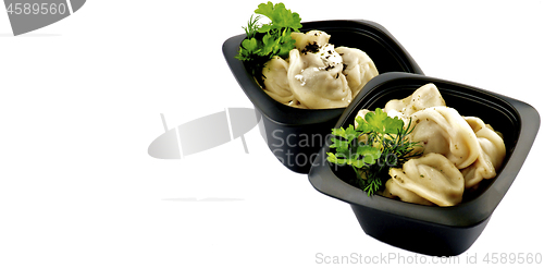 Image of Meat Dumplings with Sour Cream and Greens