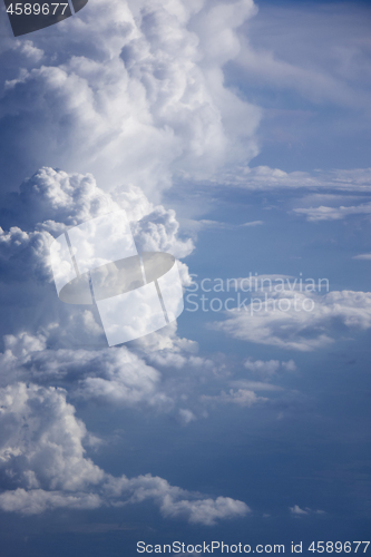 Image of Vertical clouds background with blue sky.