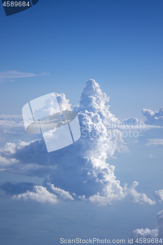 Image of Shape of big fluffy clouds on a blue sky background.