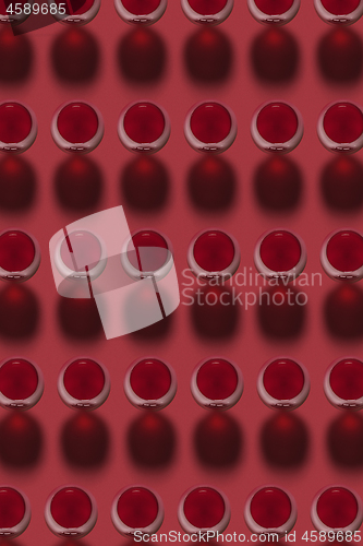 Image of Red wine glasses pattern with hard dark shadows.