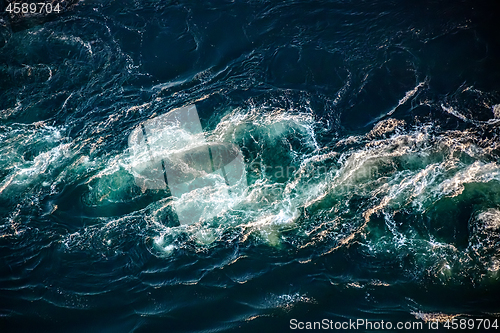 Image of Waves of water of the river and the sea meet each