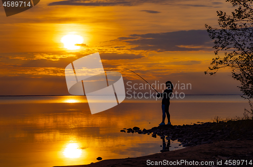 Image of Woman fishing on Fishing rod spinning in Norway.