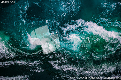 Image of Waves of water of the river and the sea meet each