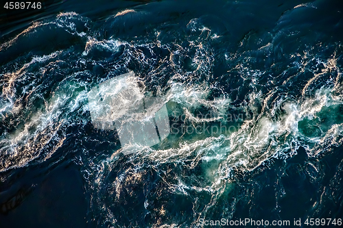 Image of Waves of water of the river and the sea meet each