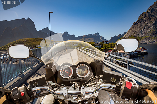 Image of Biker rides on road in Norway. First-person view.