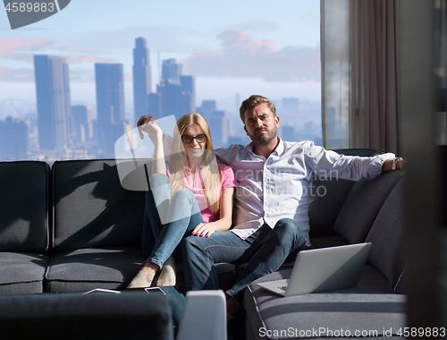 Image of couple hugging on the sofa