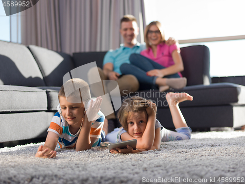 Image of couple spending time with kids