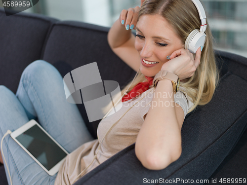 Image of girl enjoying music through headphones