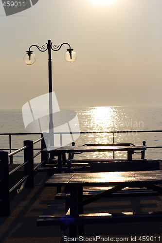 Image of sunset over fishing village in greece