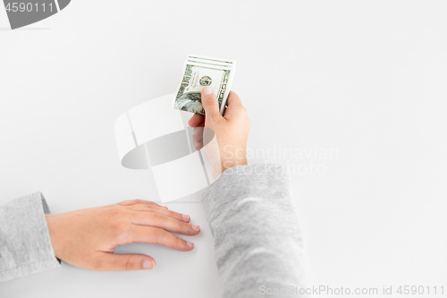 Image of close up of woman hand holding us dollar money