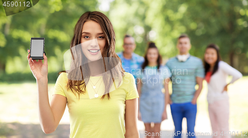 Image of young woman or teenage girl holding smartphone