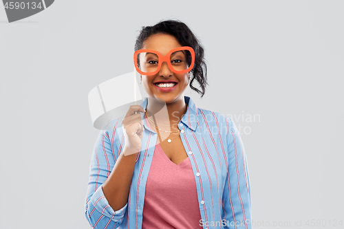 Image of happy african american woman with big glasses