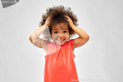 Image of overwhelmed african american girl holding to head