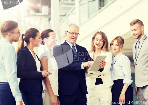 Image of business people with tablet pc computer at office