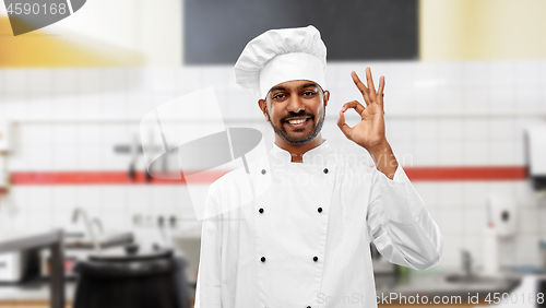 Image of indian chef showing ok sign at restaurant kitchen
