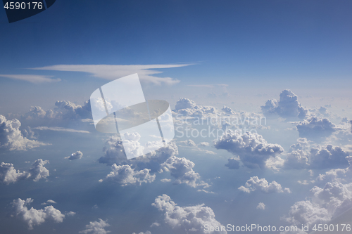 Image of Blue clear sky with white cumulus clouds.