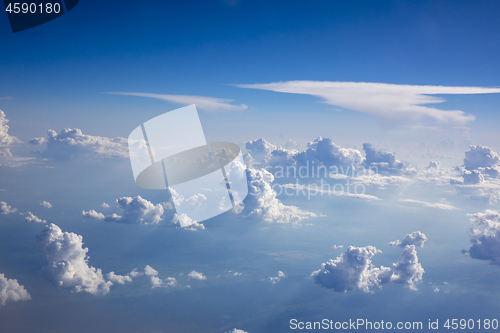 Image of Bright white clouds in a blue clear sky.