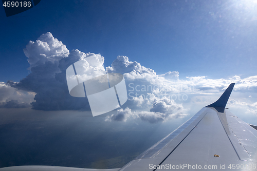 Image of Wing of aircraft on a background of clear blue sky.