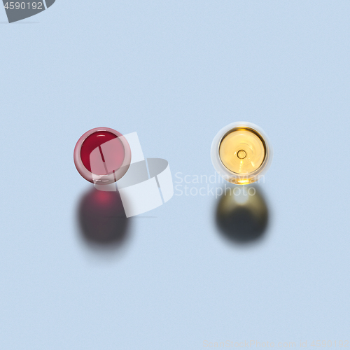 Image of Two glasses of red and white wine. Top view.