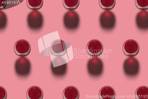 Image of Red wine glasses pattern with shadows. Top view.