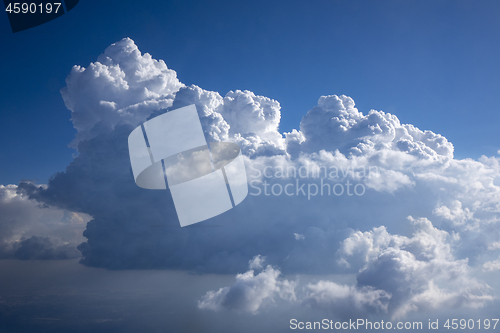 Image of Huge white clousd on a background of blue sky.