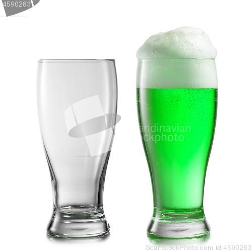 Image of Empty and full glasses of green beer on a white background.