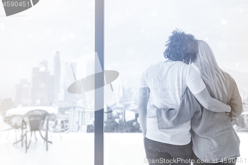 Image of young couple enjoying morning coffee by the window