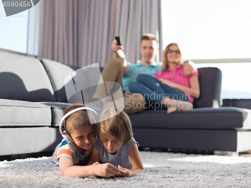 Image of couple spending time with kids