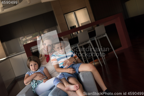 Image of young mother spending time with kids