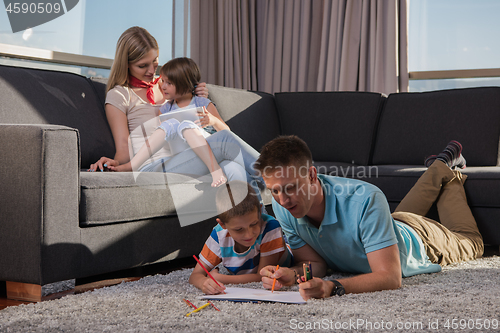 Image of young couple spending time with kids