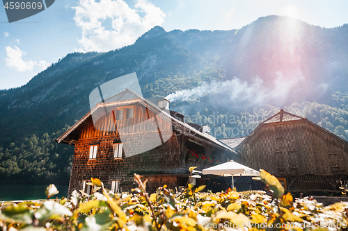 Image of Beautiful view of traditional wooden boat house at the shores of famous Lake Obersee in scenic Nationalpark Berchtesgadener Land