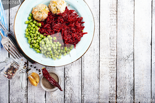 Image of cutlets with peas