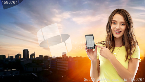 Image of young woman or teenage girl holding smartphone