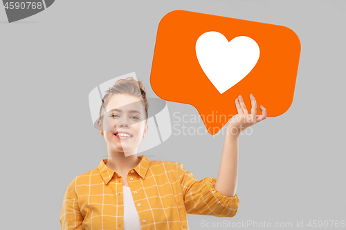 Image of red haired teenage girl holding heart icon