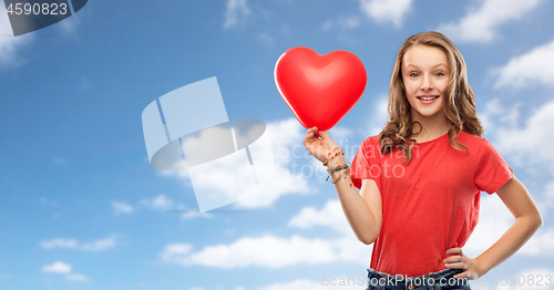 Image of smiling teenage girl with red heart shaped balloon