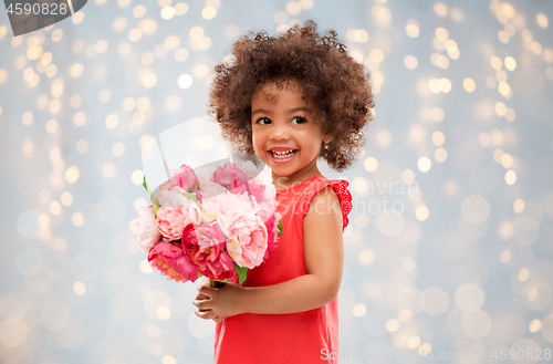 Image of happy little african american girl with flowers