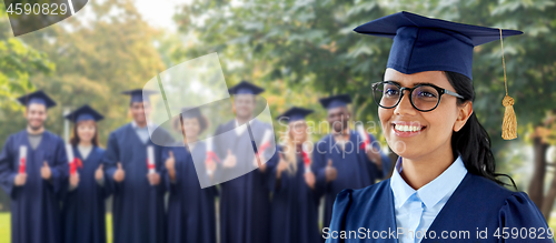 Image of happy female graduate student in mortarboard